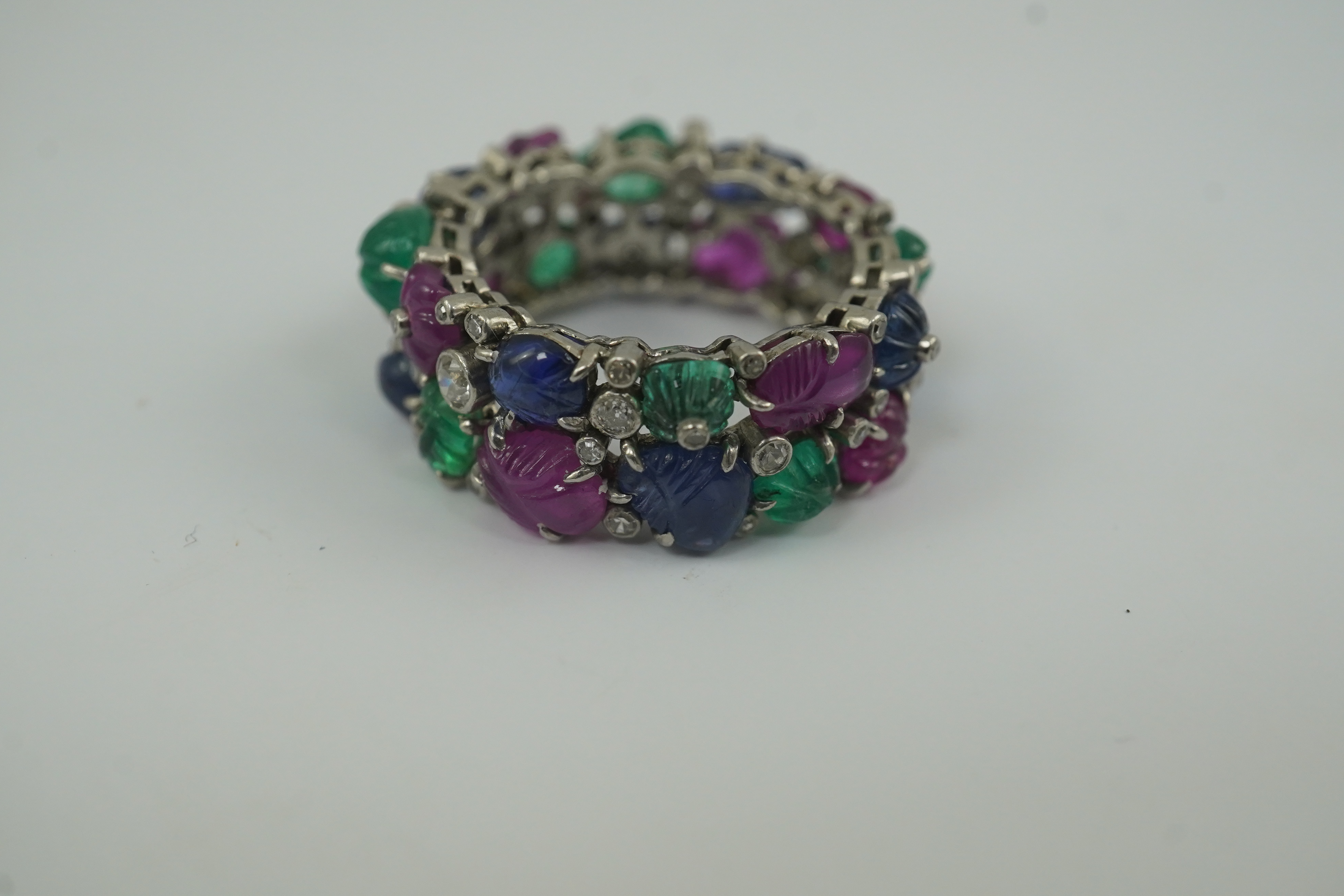 A Mauboussin style platinum, ruby, emerald, sapphire and diamond set 'Tutti Frutti' ring